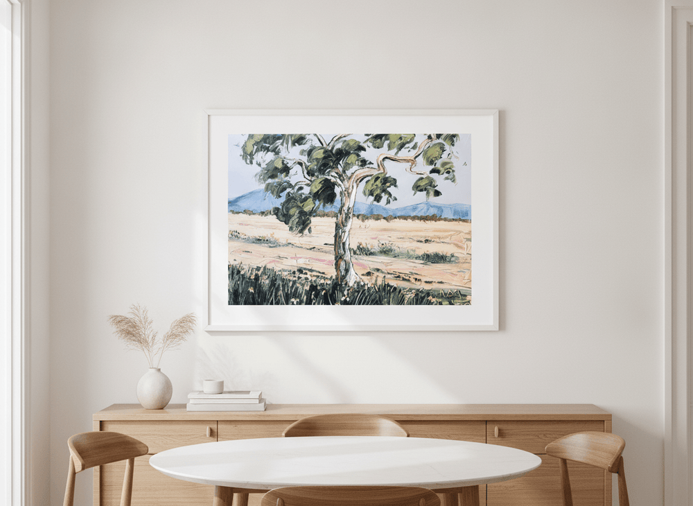 Wall art styled above a dining table in a contemporary home