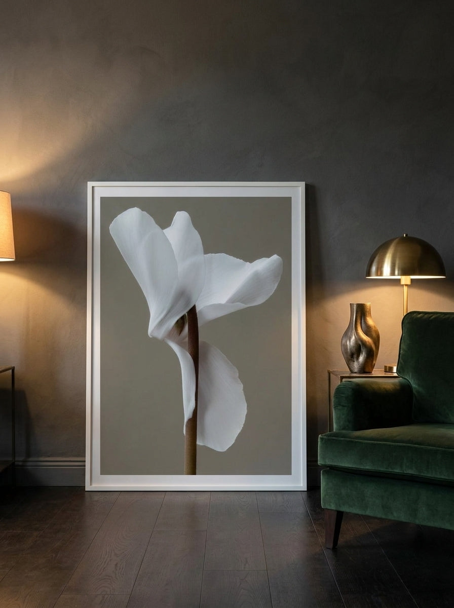 Modern wall art print leaning against the wall in a moody bedroom