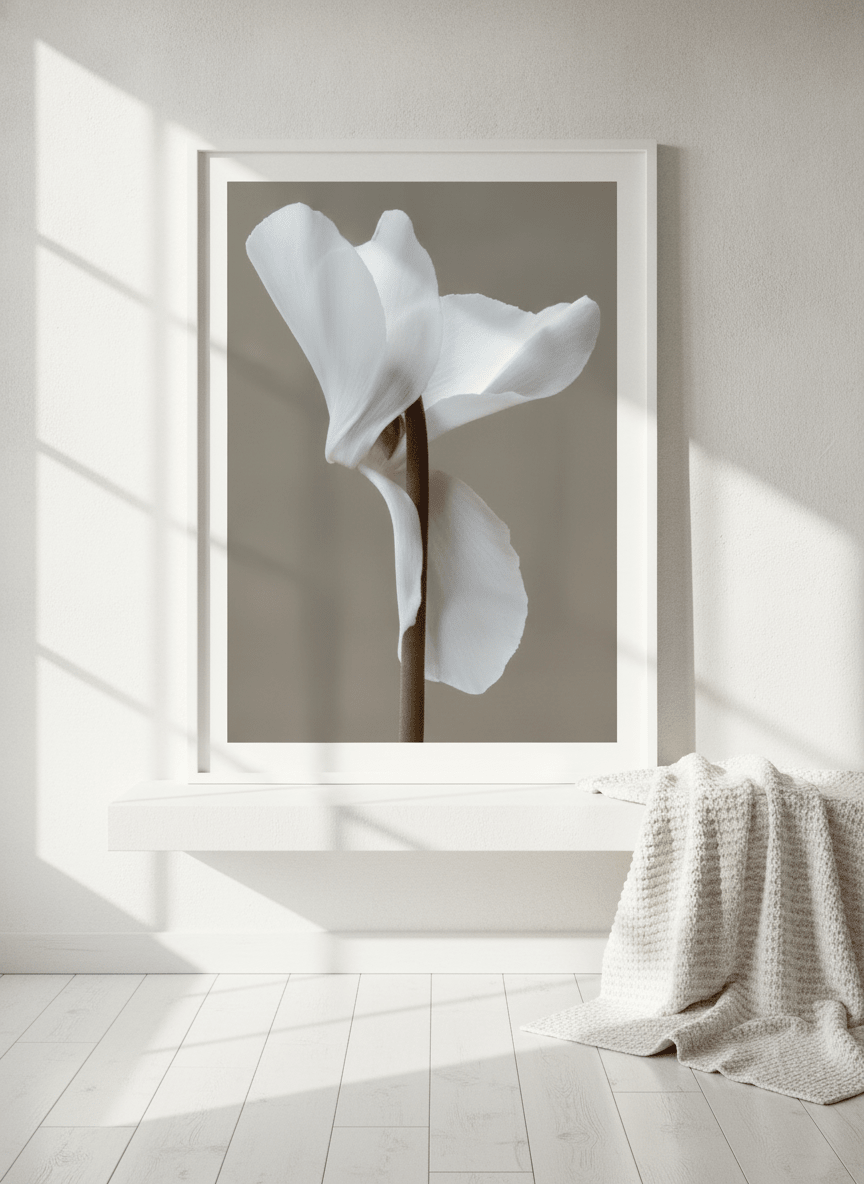 Modern wall art print standing on a shelf in a bright Scandinavian bathroom