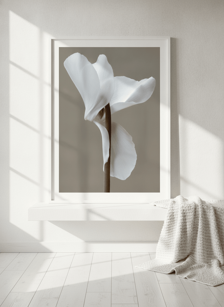 Modern wall art print standing on a shelf in a bright Scandinavian bathroom