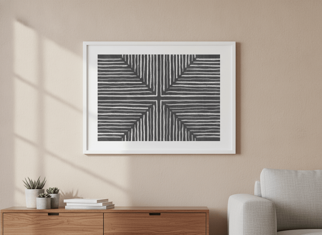 Modern wall art styled above a sofa in a neutral living room