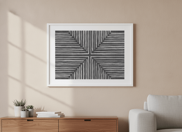 Modern wall art styled above a sofa in a neutral living room