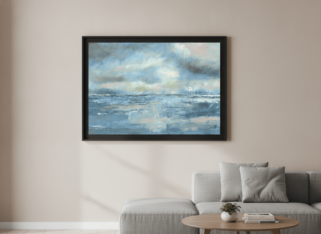 Modern wall art styled above a sofa in a neutral living room
