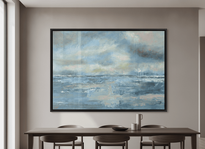 Wall art styled above a dining table in a contemporary home