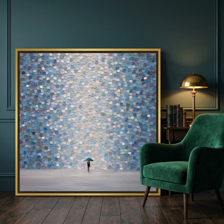 Canvas wall art with a gold leaf surround leaning against the wall in a moody home office