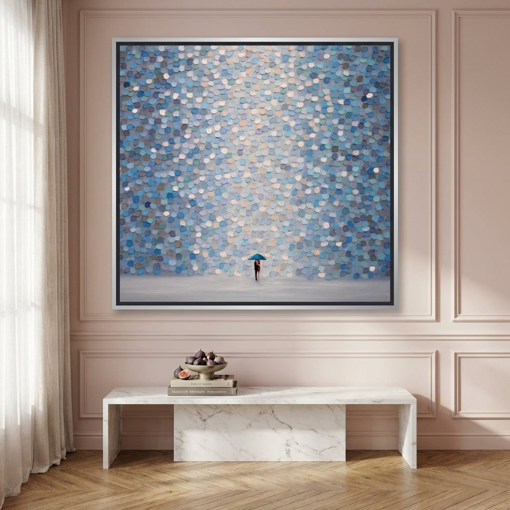 Oversized statement canvas wall art with a silver leaf surround styled on the wall in a Parisian living room