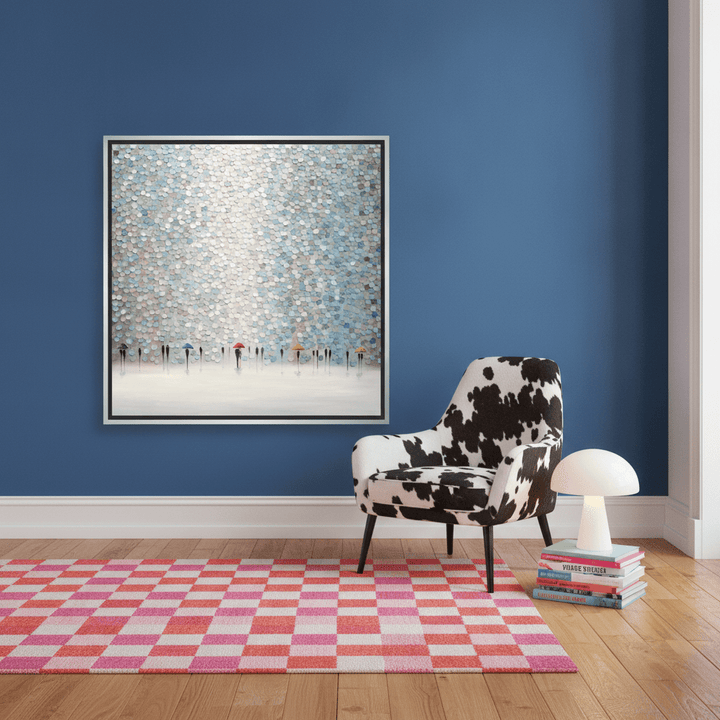 Canvas wall art with a silver leaf surround leaning against the wall in a colourful eclectic bedroom