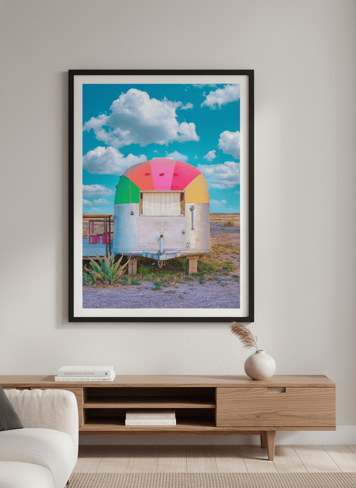 Modern wall art styled above a sofa in a neutral living room