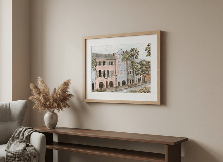 Modern wall art styled above a sofa in a neutral living room