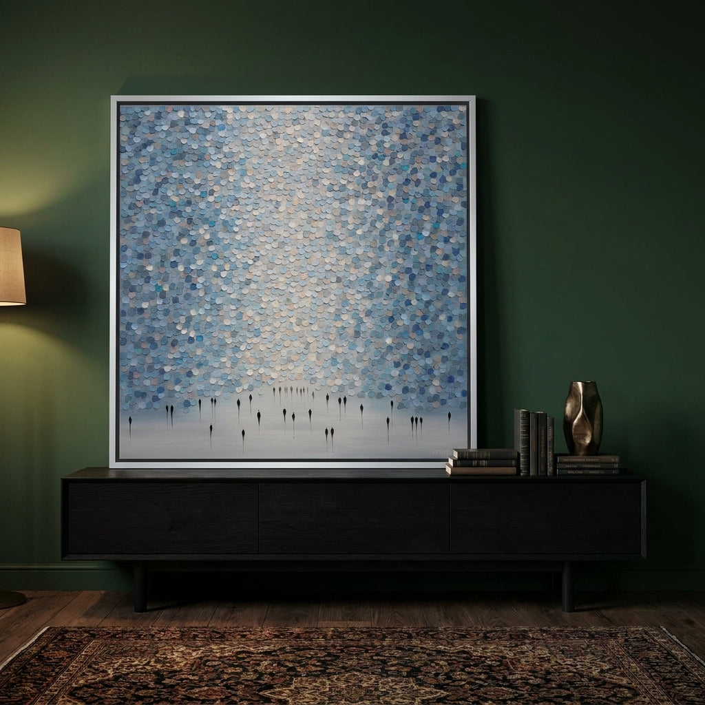 Canvas wall art with a silver leaf surround standing on a console in a moody living room