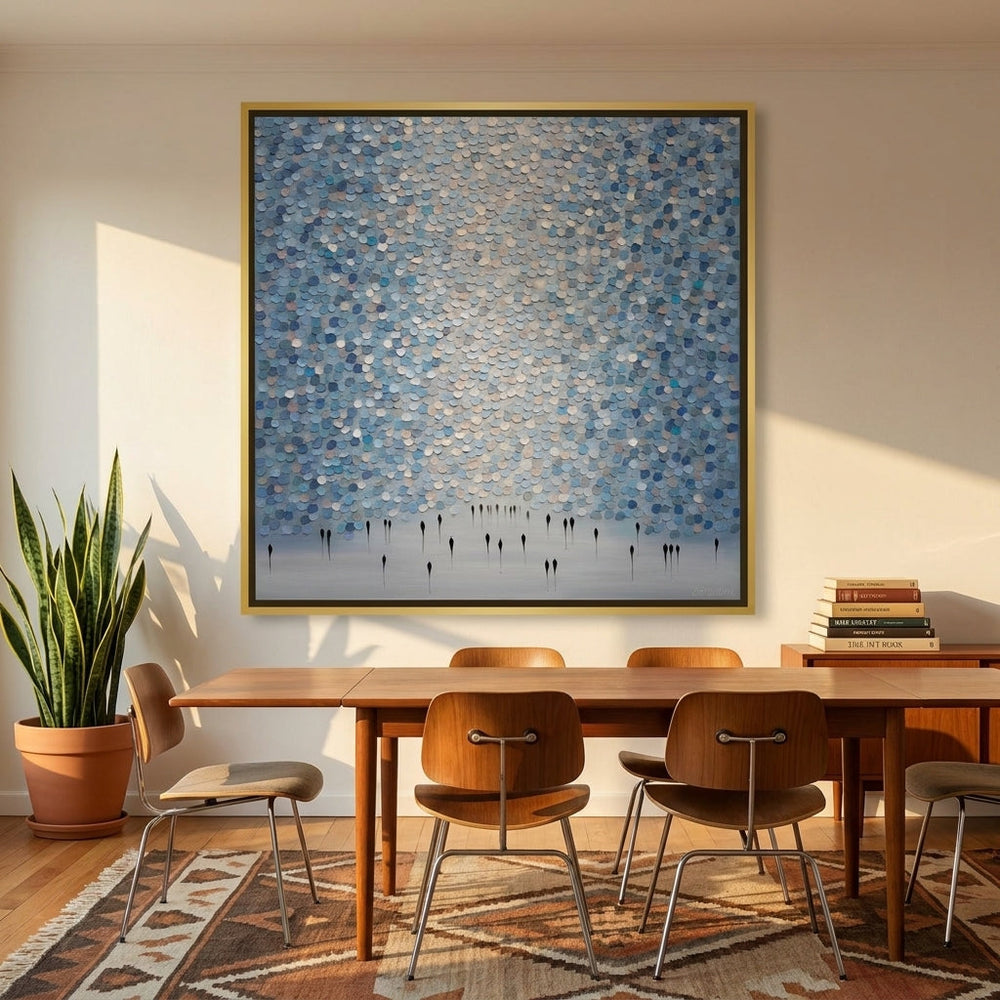 Oversized statement canvas wall art with a gold leaf surround styled on the wall in a mid-century dining room