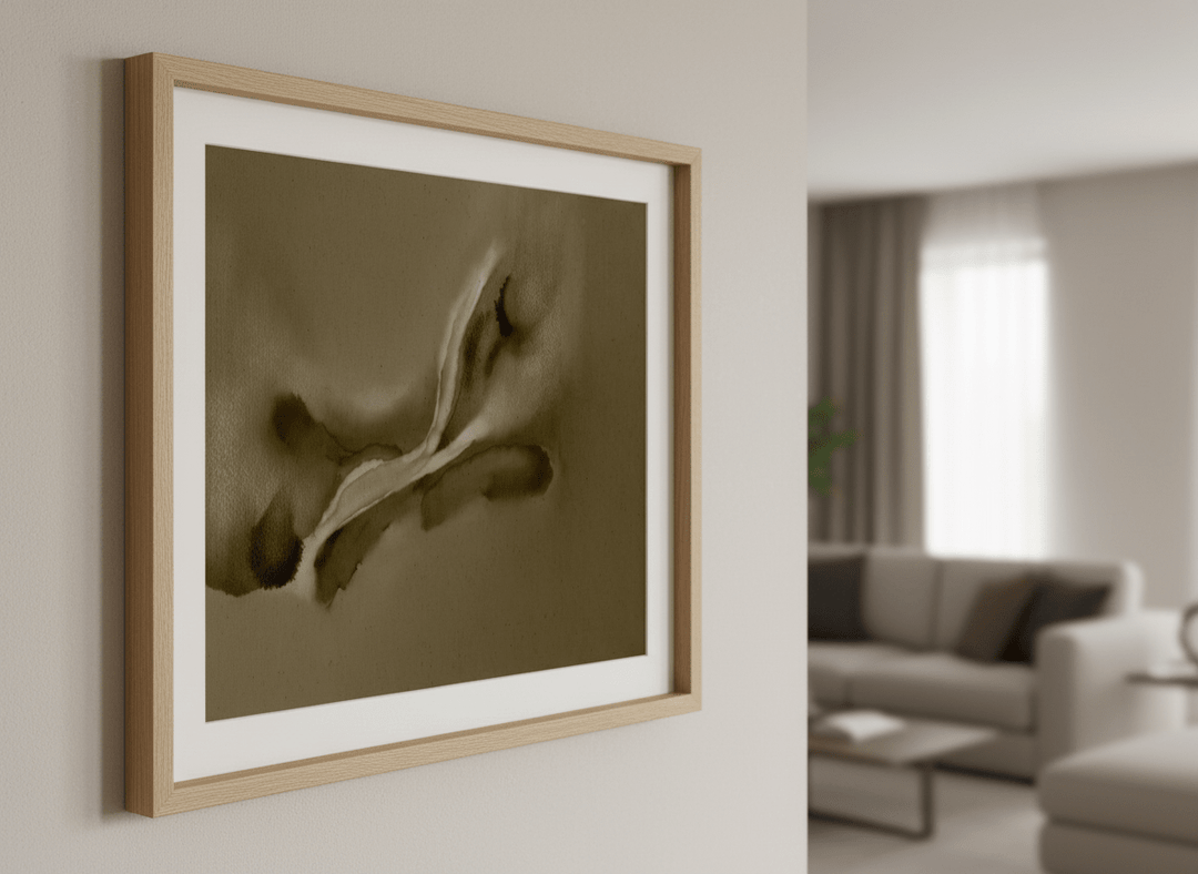 Modern wall art styled above a sofa in a neutral living room