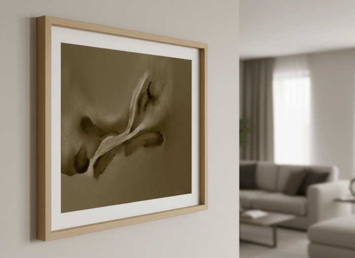 Modern wall art styled above a sofa in a neutral living room