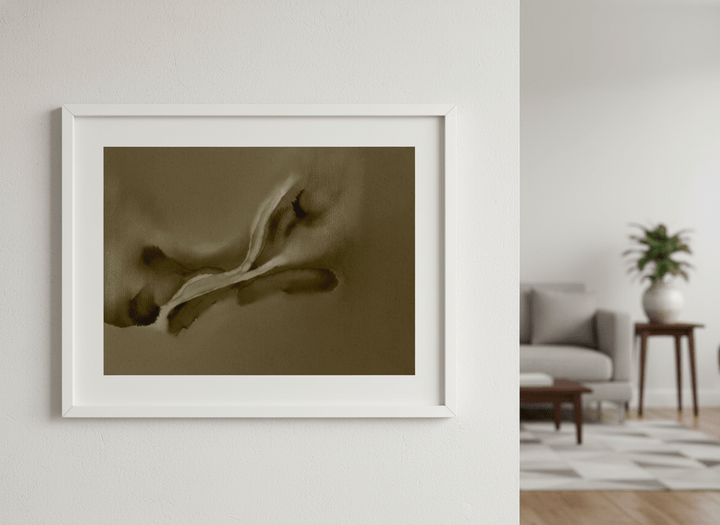 Modern wall art styled above a sofa in a neutral living room