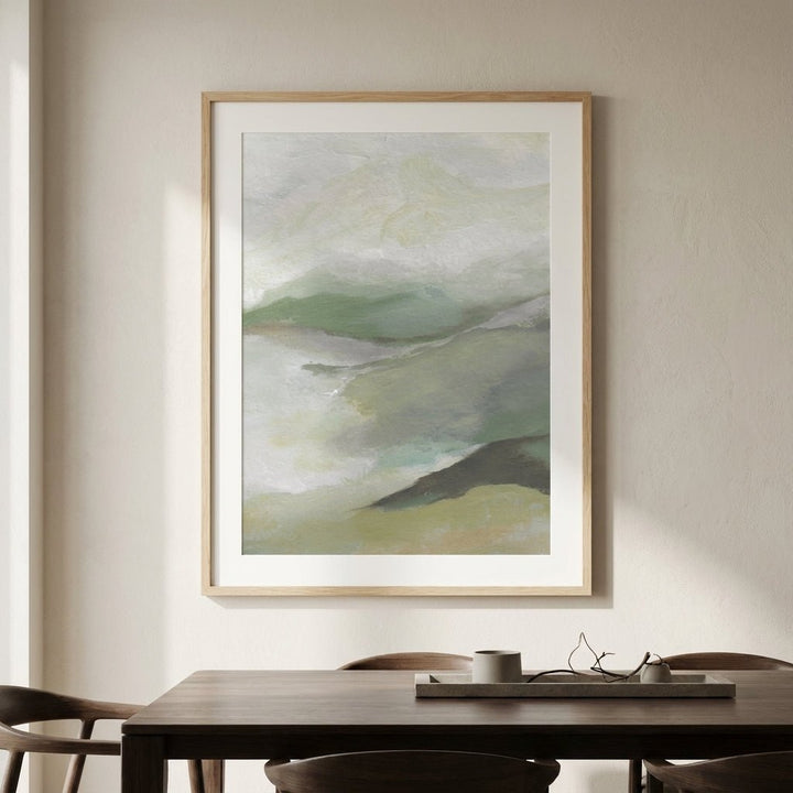 abstract painting on a wall above a wooden table with chairs.