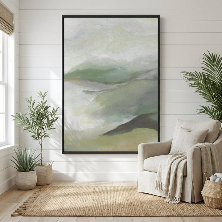 Living room with a large abstract landscape painting, beige armchair, and plants.