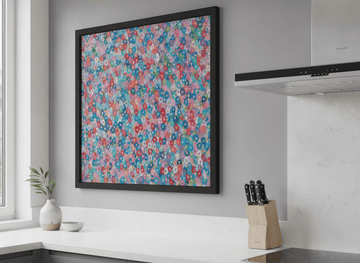 Artwork styled on the wall of a bright modern kitchen