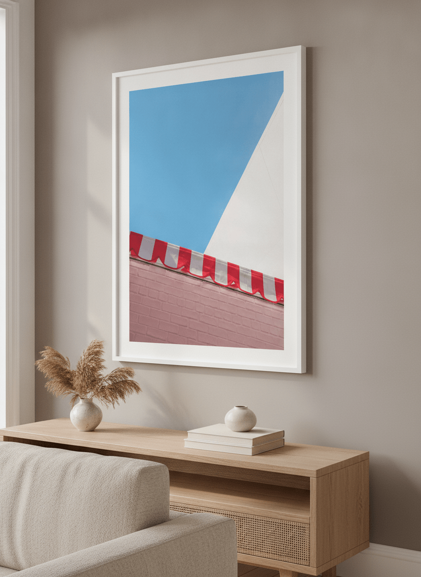 Modern wall art styled above a sofa in a neutral living room