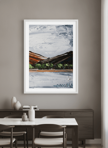 Wall art styled above a dining table in a contemporary home