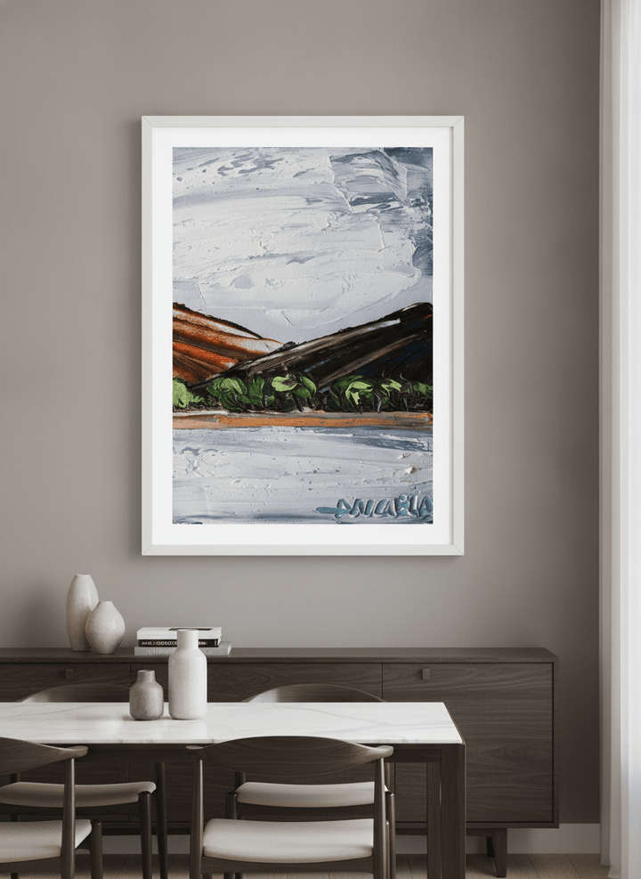 Wall art styled above a dining table in a contemporary home