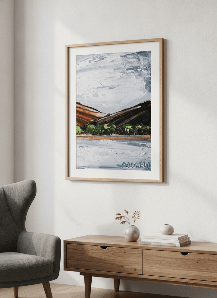 Modern wall art styled above a sofa in a neutral living room