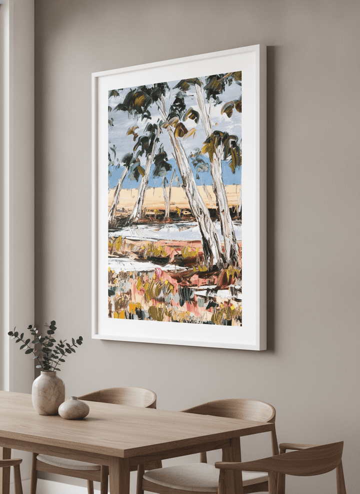 Wall art styled above a dining table in a contemporary home