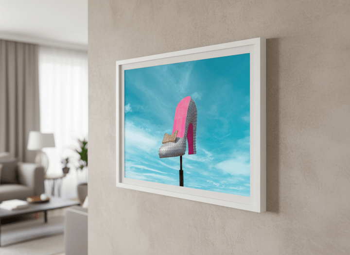 Modern wall art styled above a sofa in a neutral living room