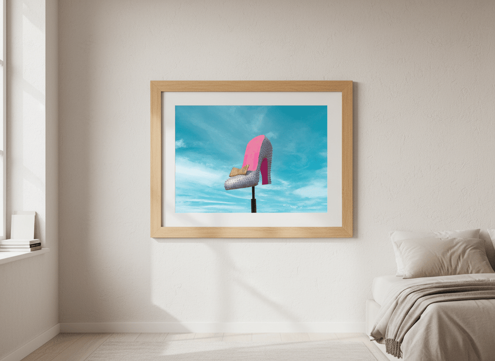 Minimalist artwork displayed in a calm, light-filled bedroom interior