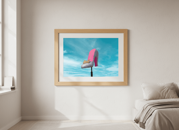 Minimalist artwork displayed in a calm, light-filled bedroom interior