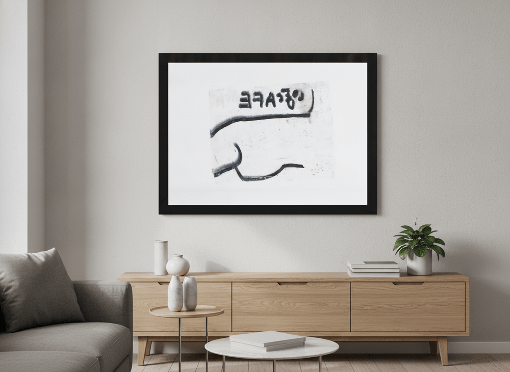 Modern wall art styled above a sofa in a neutral living room