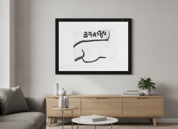 Modern wall art styled above a sofa in a neutral living room