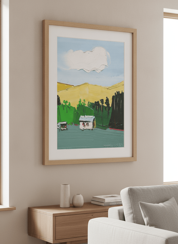 Modern wall art styled above a sofa in a neutral living room