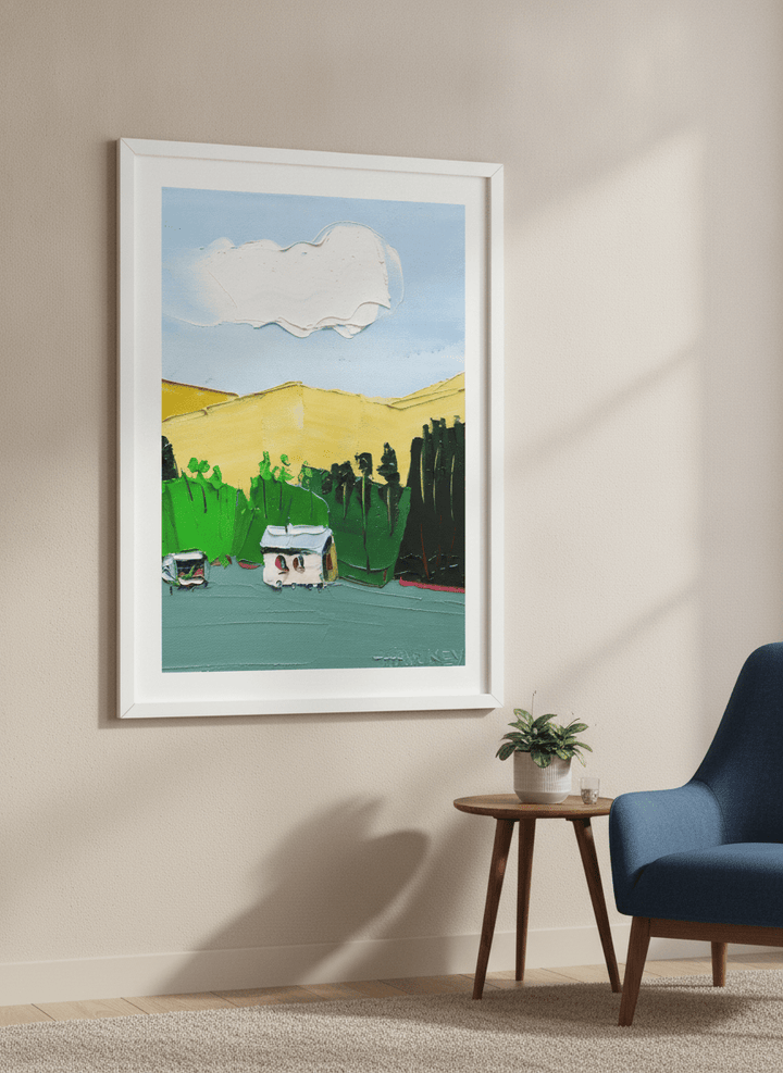 Modern wall art styled above a sofa in a neutral living room