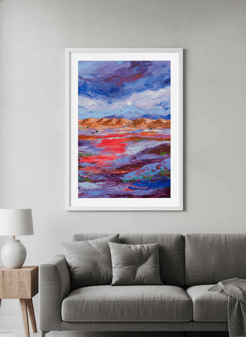 Modern wall art styled above a sofa in a neutral living room