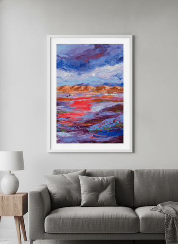 Modern wall art styled above a sofa in a neutral living room
