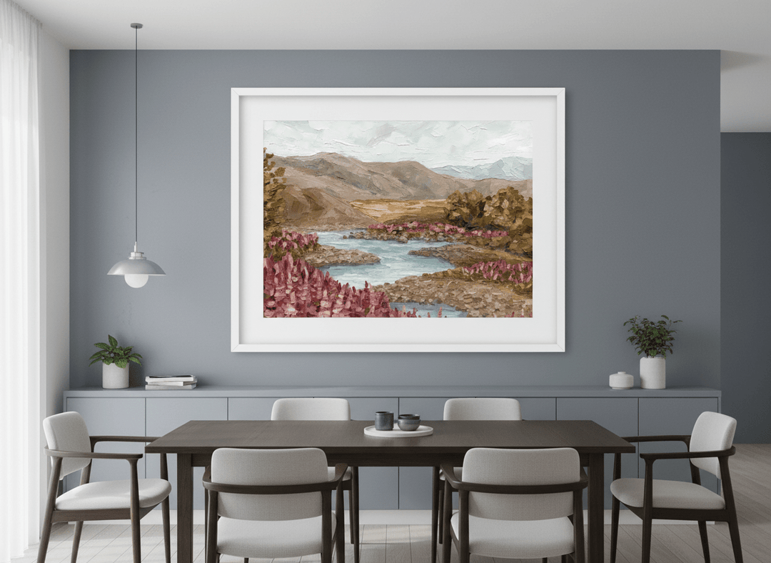 Wall art styled above a dining table in a contemporary home