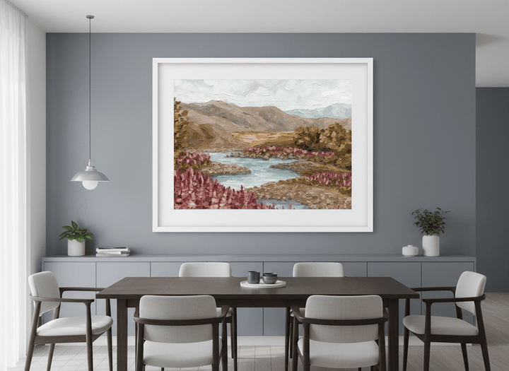 Wall art styled above a dining table in a contemporary home
