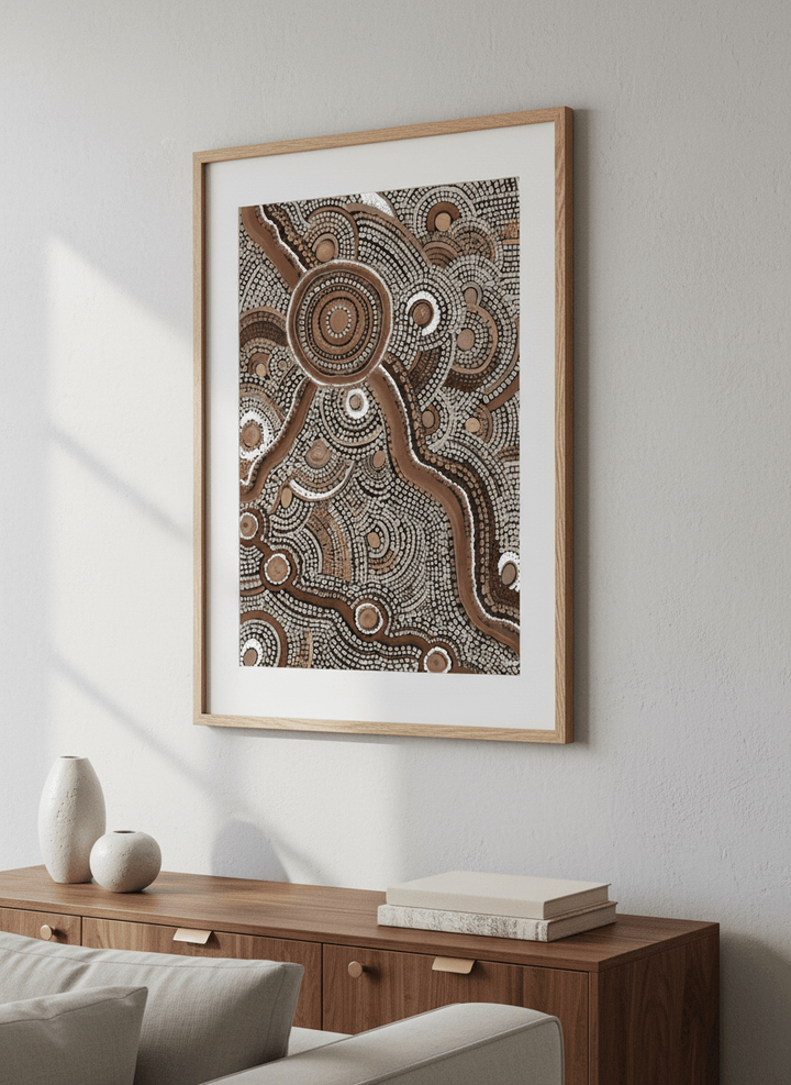 Modern wall art styled above a sofa in a neutral living room