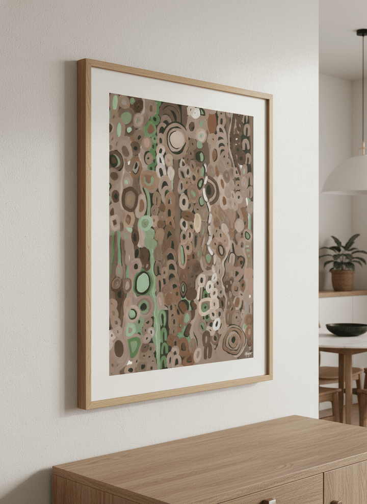 Wall art styled above a dining table in a contemporary home
