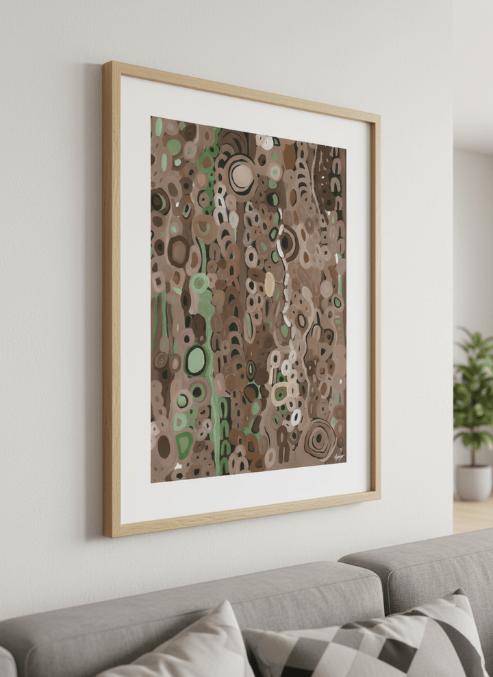 Modern wall art styled above a sofa in a neutral living room