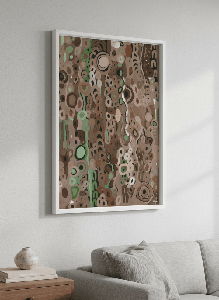Modern wall art styled above a sofa in a neutral living room
