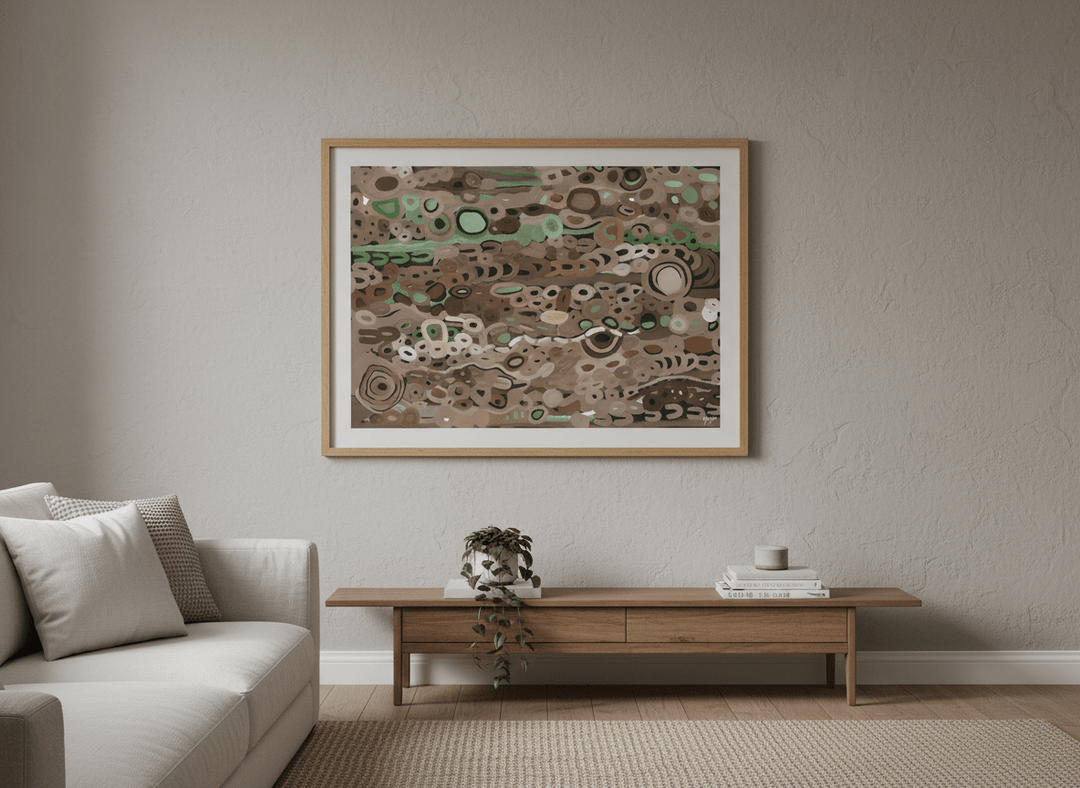 Modern wall art styled above a sofa in a neutral living room
