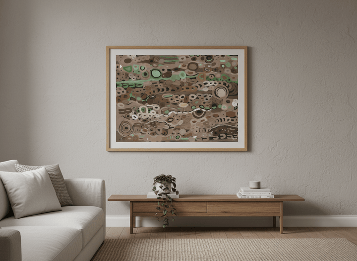Modern wall art styled above a sofa in a neutral living room