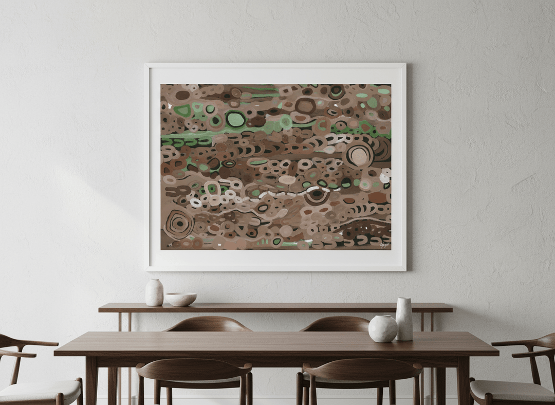 Wall art styled above a dining table in a contemporary home