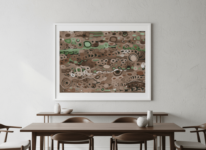 Wall art styled above a dining table in a contemporary home