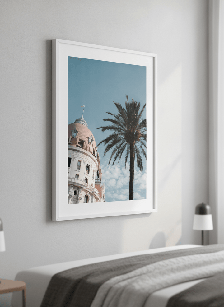 Minimalist artwork displayed in a calm, light-filled bedroom interior