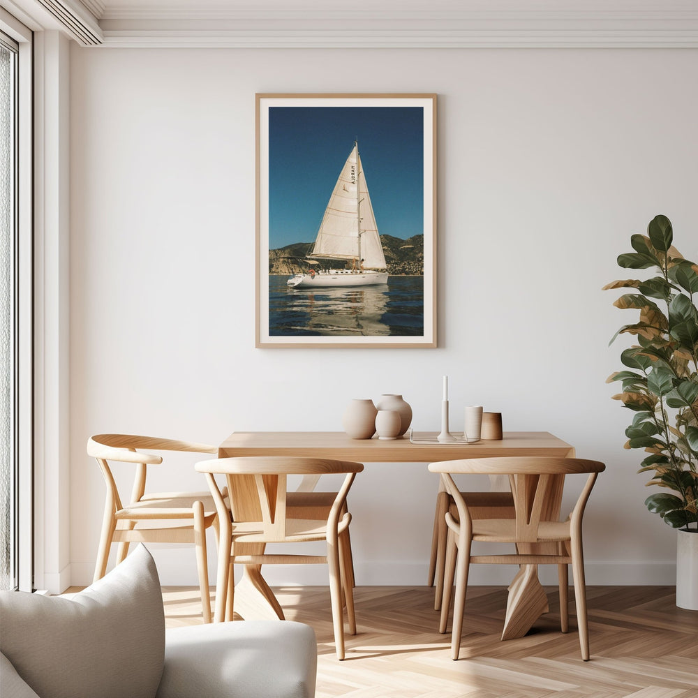 Portrait on wall above dining table and chairs