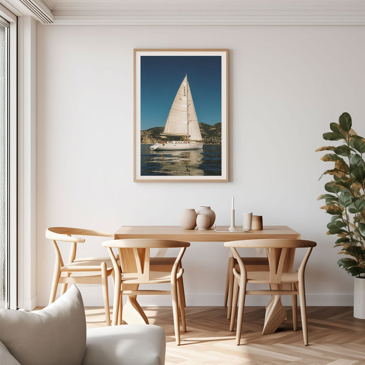 Portrait on wall above dining table and chairs