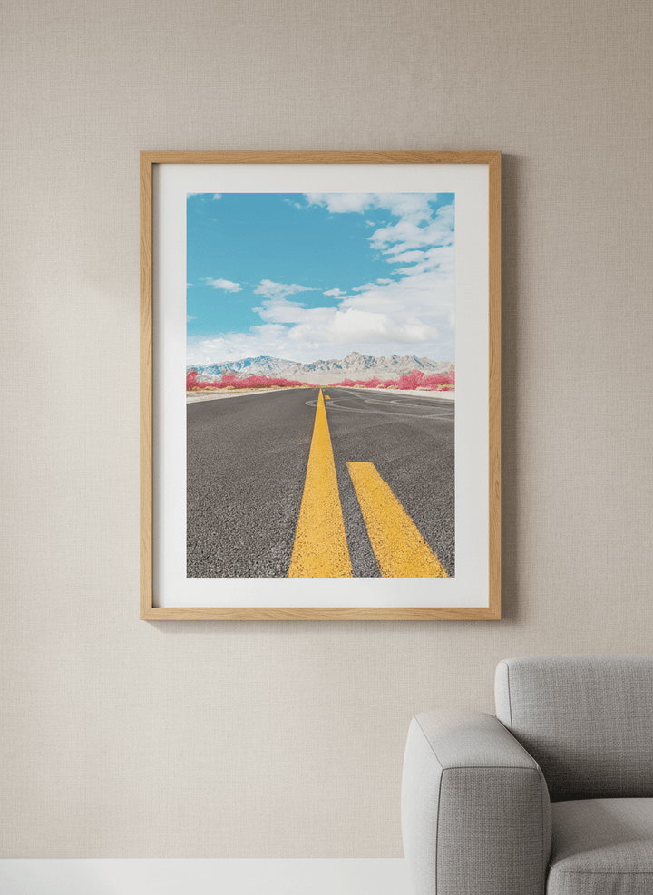 Modern wall art styled above a sofa in a neutral living room