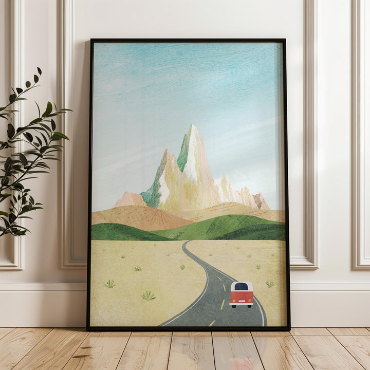 Artwork of a road with a van and mountains on a wall.